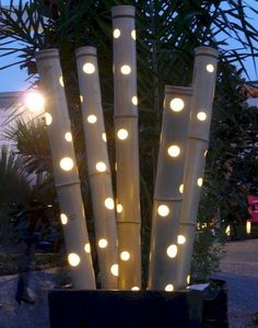 some lights that are sitting in a planter