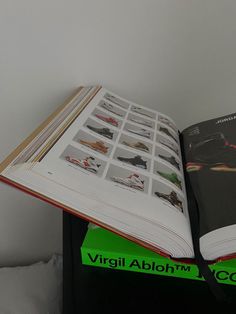 an open book sitting on top of a stack of books