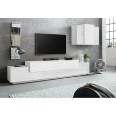 a white entertainment center with a flat screen tv