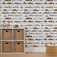 fish wallpaper in a children's room with baskets on the floor and a basket next to it