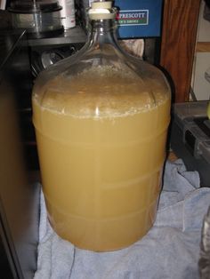 a large jug sitting on top of a blue towel