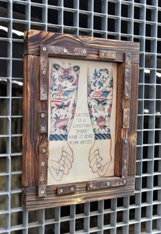 a wooden frame with some tattoos on it