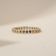 Timeless, elegant & dainty, this rich shade of blue will make you feel like royalty each time you gaze at your hand! This can be your vibrant and unique wedding band, yet also the perfect dainty ring to add a pop of color to your solid gold ring stack. This is a full eternity band surrounding the entire finger. Choose your metal and size, and we will make it custom for you. September's birthstone is a stunning ring to stack with your wedding ring! - Handmade - Solid Gold - Natural Blue Sapphire - Total Sapphire Carat Weight: 1 ctw for size 6.5 - Width of the Band: 2.5 mm - Height of the Band: 1.7 mm 🛠 Your Sarah Elise piece is handcrafted with care! Ready-to-ship items go out within 3 business days. Made-to-order pieces typically take 7-10 business days to create. If you need something so Bezel Eternity Band, Birthstone Wedding Ring, Sapphire Eternity Band, Sapphire Eternity Ring, Unique Wedding Bands, Wedding Ring Set, Initial Jewelry, Eternity Band