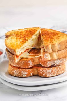 a grilled cheese sandwich on a white plate