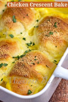 chicken crescent bread bake in a white casserole dish with parsley on top