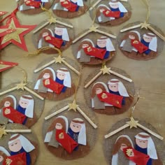 christmas ornaments made to look like the nativity scene with angels and stars on them