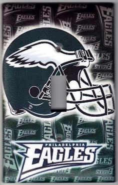 the philadelphia eagles light switch plate cover is made from green and white fabric with an eagle helmet on it