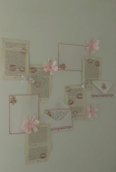 several pieces of paper with pink flowers on them