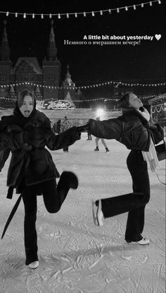 two people are dancing in the snow at night