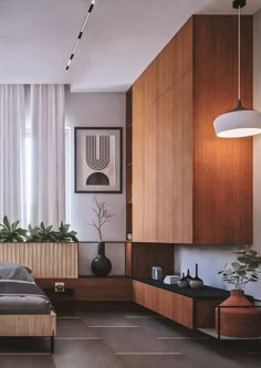 a modern bedroom with wood paneling and white drapes on the windowsills