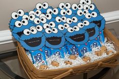 a basket filled with cookies and cookie monster treats