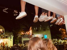 people are hanging upside down from the ceiling