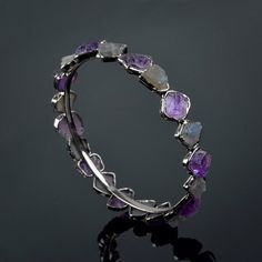 GemFormingStudio D E T A I L S Amethyst & Labradorite Bangle | Rough Stone Bangle | Gemstone Bangle | Handmade Bangle | Brass Bangle | Brass Jewelry | New Design | Gift For Women ( GFS4465 ) Stone Size : 12x11 mm ( Approx ) Weight : 23.00 gm Bangle Size : All Size Available Color : Multi Color Material : Brass Polish : All Polish Are Available . Contact us for wholesale prices. R I N G S https://www.etsy.com/in-en/shop/GemFormingStudio?section_id=22783374 B E A D S https://www.etsy.com/in-en Amethyst Bangle Bracelets For Anniversary, Crystal Gemstone Bangle Bracelet For Wedding, Purple Bangle Jewelry For Wedding, Adjustable Stackable Round Bracelets, Adjustable Silver Crystal Bracelet With Stones, Adjustable Gemstone Bangle For Wedding, Adjustable Crystal Stone Bracelet For Weddings, Adjustable Crystal Bracelet With Stones For Wedding, Stones Bangle For Gift