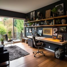 a home office with black walls and wooden floors