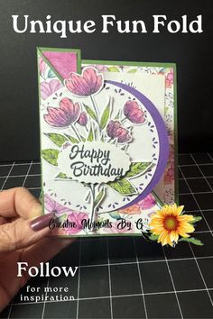 someone holding up a card with flowers on it and the words, unique fun fold