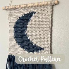 a crochet wall hanging with the moon on it and text overlay reading, crochet pattern