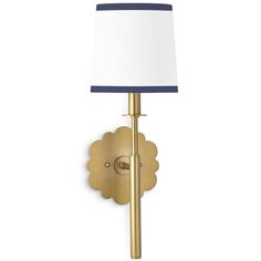 a gold wall light with a white shade on the side and a blue trim around the lamp