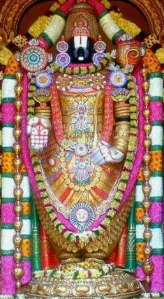 the statue of lord ganesha is decorated with colorful colors