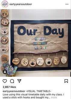 a bulletin board with buttons on it that says our day and is hung up against the wall