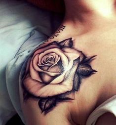 a woman with a rose tattoo on her chest