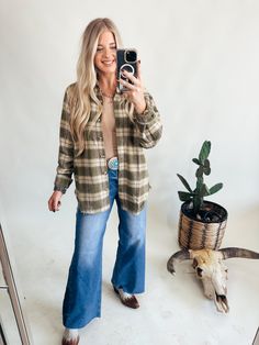 Y'all are going to love the Marcie Shirt features a relaxed, oversized fit with extended shoulders and a button-down front. The collared neckline and long sleeves are complemented by button cuffs, all made from 100% polyester with a classic olive plaid print. Madalynn is 5'7" and wearing her Normal Size Med S 2/4, M6/8, L10/12 Authentic Turquoise Jewelry, Mini Accessories, Wild Rag, Plaid Print, Oversized Fits, Womens Bottoms, Shopping Outfit, Dress Outfits, Long Sleeves