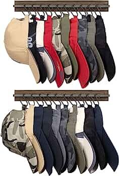 several pairs of socks hanging from hooks on a rack with hats and pants in them