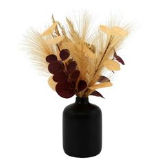 a black vase filled with lots of dried flowers