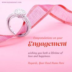 two wedding rings on pink ribbon with congratulations message