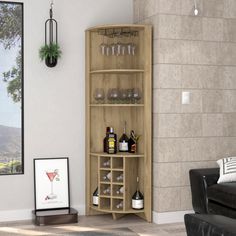 a living room filled with furniture next to a wall mounted wine glass holder and liquor bottles