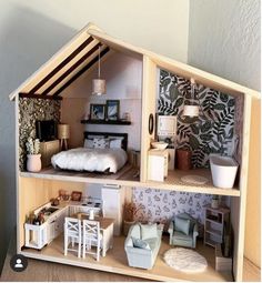 a doll house with furniture and accessories in it