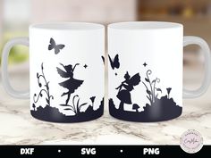 two coffee mugs sitting on top of a counter with the silhouettes of tinkerbells and butterflies