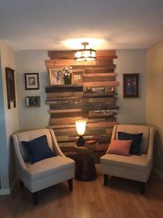 two chairs sitting next to each other on top of a hard wood floor