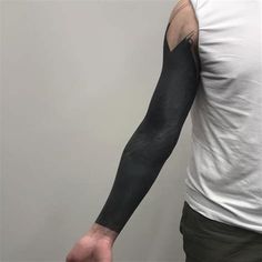 a man with a tattoo on his arm