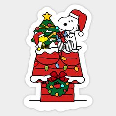 a sticker with a dog sitting on top of a christmas tree