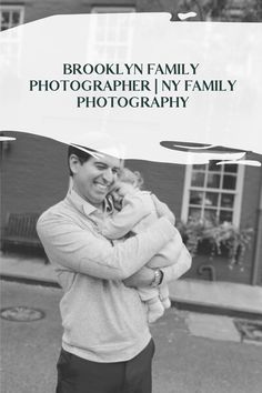 a man holding a baby in his arms with the caption brooklyn family photographer / ny family photography