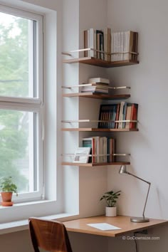 a desk with a lamp, bookshelf and some plants on it in front of a window