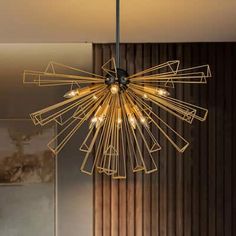 a chandelier hanging from the ceiling in a living room