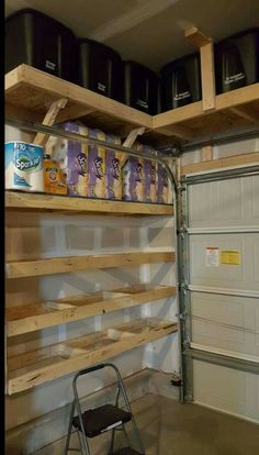 there is a garage with some shelves on the wall