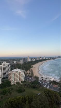 an aerial view of the beach and ocean in surfers paradise, with high rise buildings