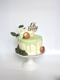 a green and white cake sitting on top of a table