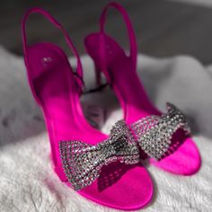 Slingback High Heels With Embellished Bow. Heel Height: 3.9 Inches (10 Cm) Airfit. Flexible Technical Sole Made Of Latex Foam Designed To Offer Increased Comfort. Color: Fuchsia Size: Us 6.5 (Eu 37) Upper 100% Polyester Lining 100% Polyurethane Sole 100% Polyurethane Thermoplastic Insole 70% Goat Leather 30% Polyester Bloggers Fav Sold Out!! Crystal Embellished Open Heel Sandals For Gala, Bedazzled Heels With Ankle Strap For Events, Pink Slingback Pumps With Heel Strap For Gala, Pink Slingback Pumps For Gala With Heel Strap, Pink Embellished Slingback Heels, Chic Bedazzled Ankle Strap Heels, Elegant Pink Slingback Pumps For Gala, Glamorous High Heel Bedazzled Sandals, Glamorous Bedazzled High Heel Sandals