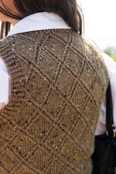 the back of a woman's sweater vest