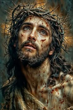 the face of jesus with blood on his body and crown of thorns over his head