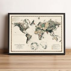 a framed world map on a wooden shelf