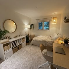 a bedroom with a bed, desk and shelves