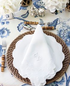 a place setting with napkins and silverware