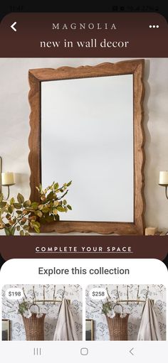 a mirror sitting on top of a table next to a vase with flowers in it