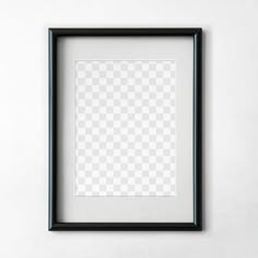 an empty black frame hanging on the wall