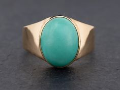 Vintage blue turquoise ring featuring a 12 x 9 mm oval shape cabochon turquoise bezel set in 14k gold.  Condition: Very Good to Good. Wear commensurate with age. Material: 14k Yellow Gold Hallmarks: "14k" "585" "PV"   Gram Weight: 5.9 grams Ring Size: 7 Main Stone: Natural Turquoise Dimensions: 12 x 9 mm Shape: Oval Cabochon Color: Greenish Blue Oval Anniversary Ring, Gold Hallmarks, Vintage Turquoise Ring, Bezel Ring, Greenish Blue, Vintage Turquoise, Natural Turquoise, Anniversary Ring, Oval Cabochon