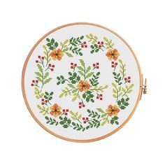 a cross stitch pattern with flowers and leaves in the center on a white background,